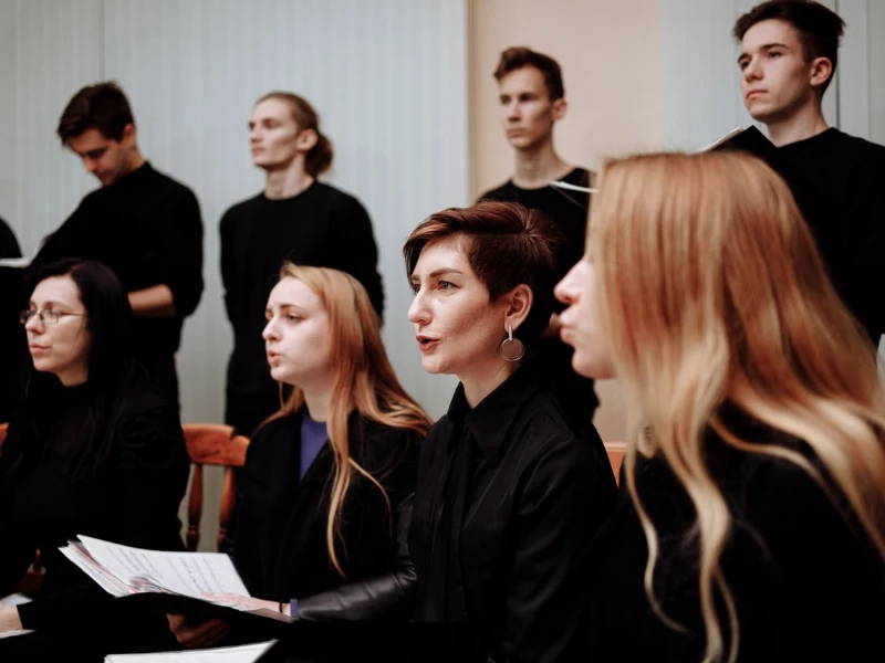 Chamber choir singing from printed scores