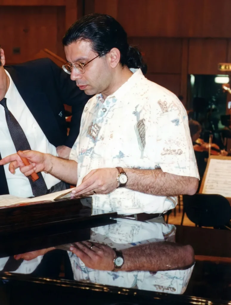 Samy Elgazzar preparing music in a vintage recording session.