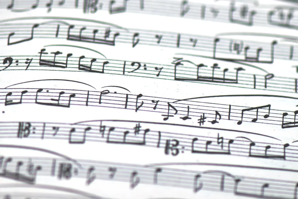 handwritten instrumental parts in ink on manuscript paper